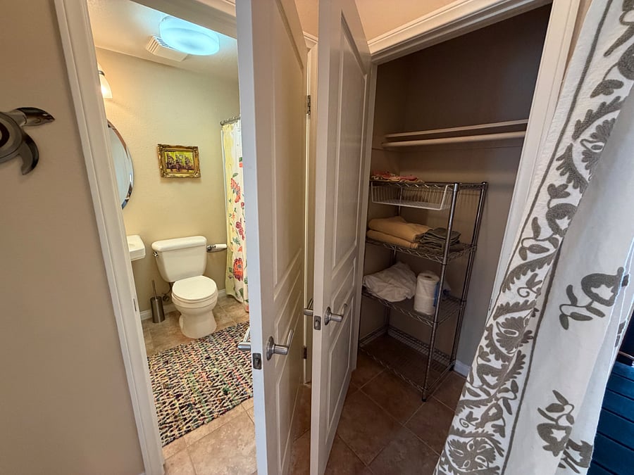 View of entrance to your en-suite bathroom and extra 2nd storage closet in your master suite.
