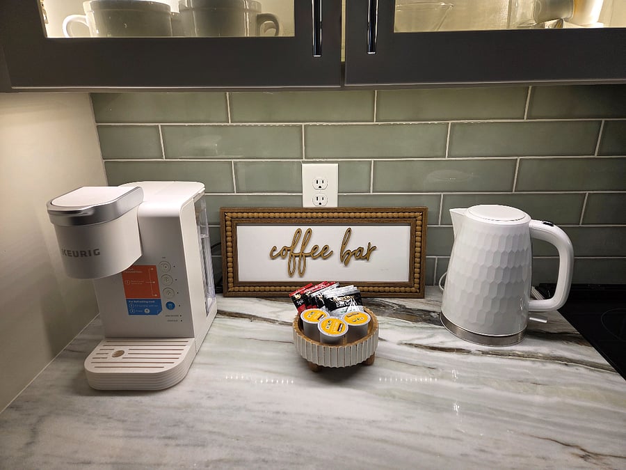 Keurig coffee maker, starter pods, starter tea bags and electric water kettle. 