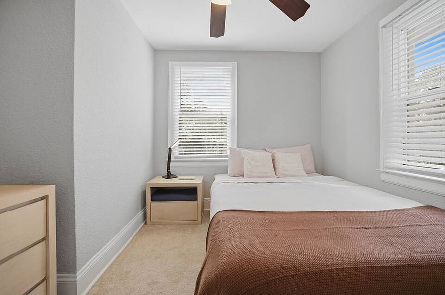 Bedroom 4: A cozy, quiet spot with a queen size bed for a great night's sleep.