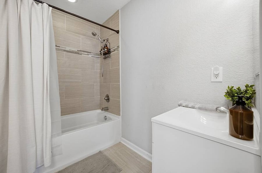 Primary en-suite bathroom with 2 vanity sinks.