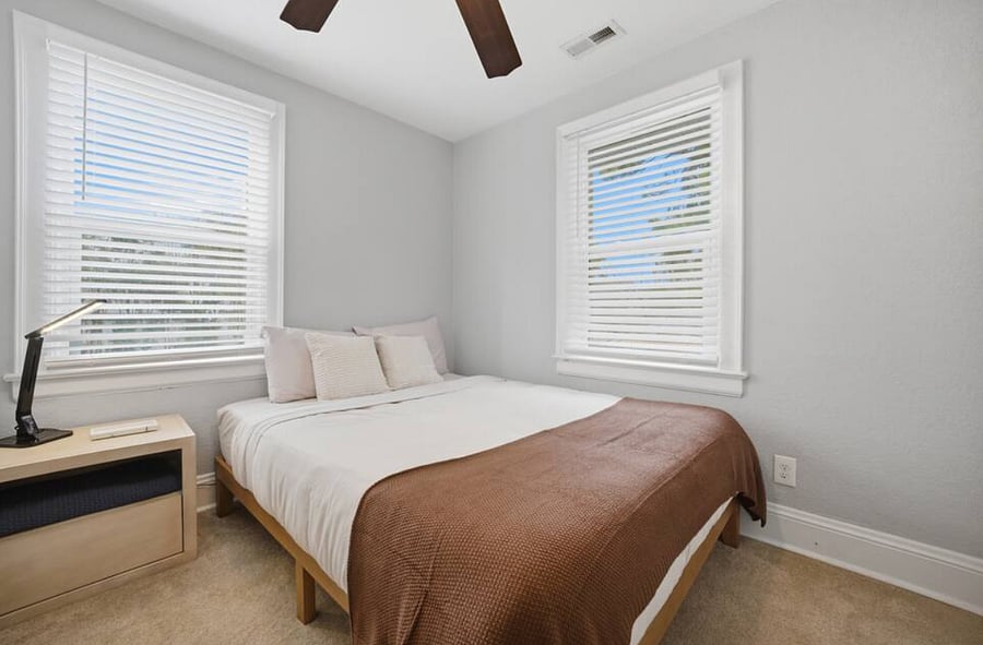 Bedroom 4: A cozy, quiet spot with a queen size bed for a great night's sleep.