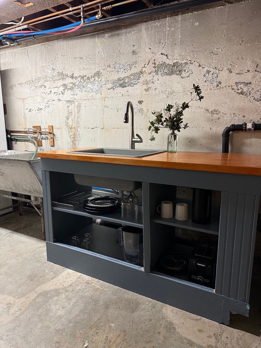 Butcherblock counter with new sink and storage. Dishes, glasses, cutlery included. Toaster oven/Fryer/Baker Oven all in one included.