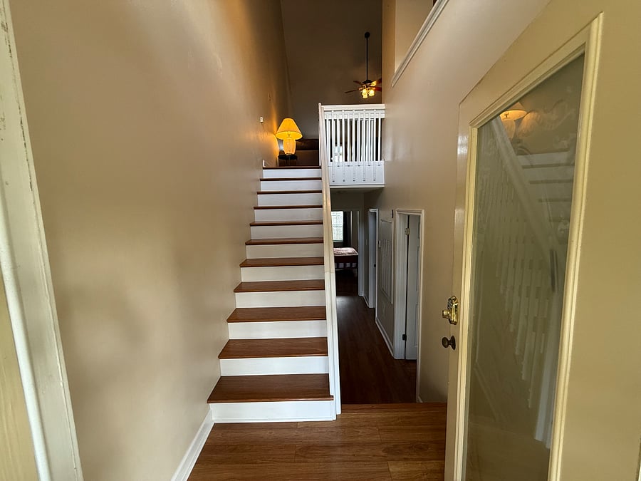 Split condo with 2 bedrooms and 2 bathrooms downstairs and living room and kitchen upstairs