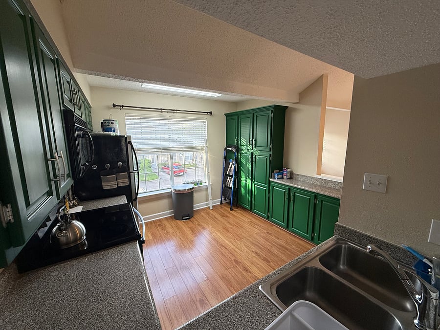 Upstairs kitchen with dishwasher, electric stove, microwave, and full-sized fridge