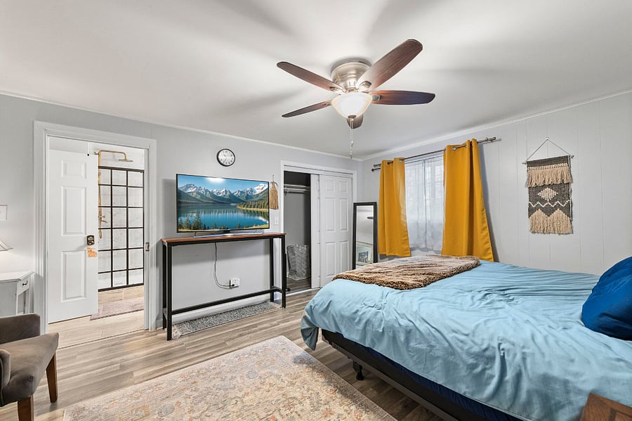 bedroom with king bed and desk