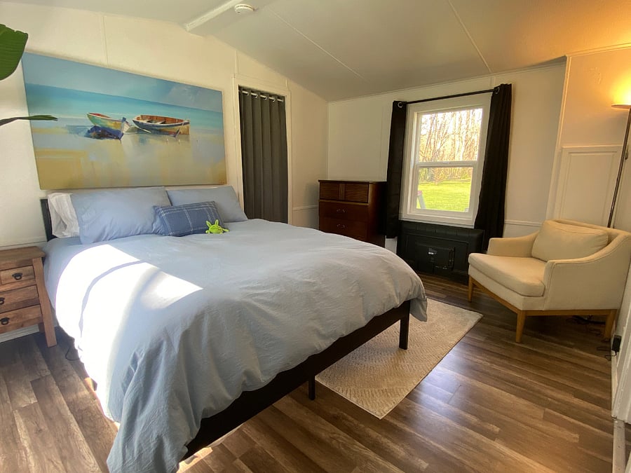 Primary suite located at one end of guesthouse. The 2nd bedroom is at the opposite end. Luxury bedding and ensuite bath with shower
