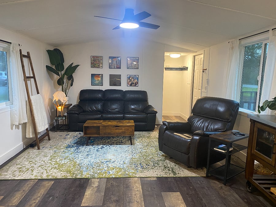 Open concept. Comfy living area. View from kitchen .Like new reclining furniture and Smart Tv for evening relaxation