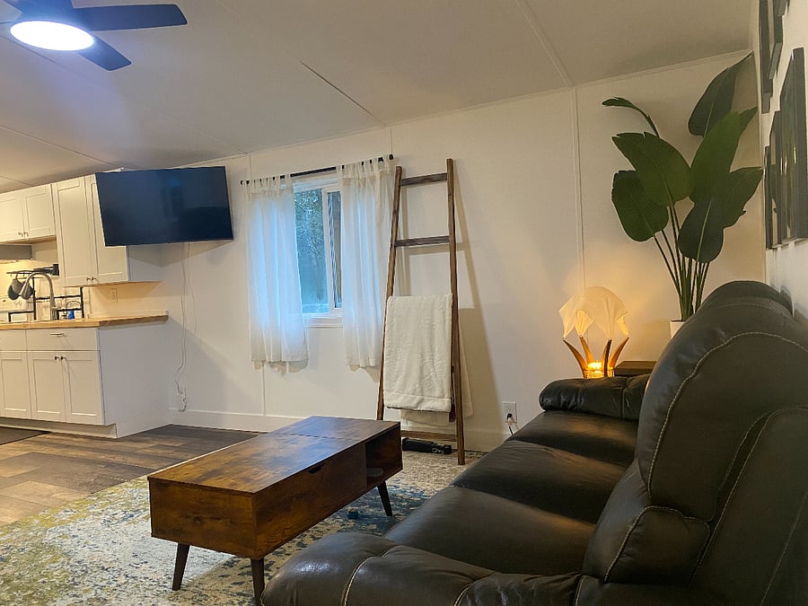 Living area, view from front door area. Vaulted ceiling and open to the kitchen and dining area