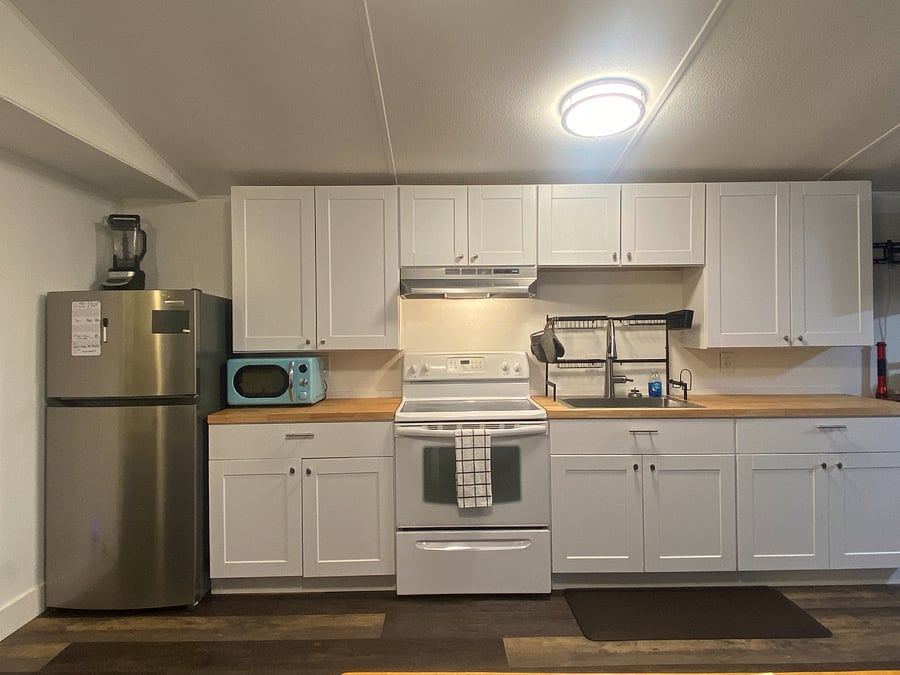 Fully equipped kitchen with plenty of storage and a walk-in pantry