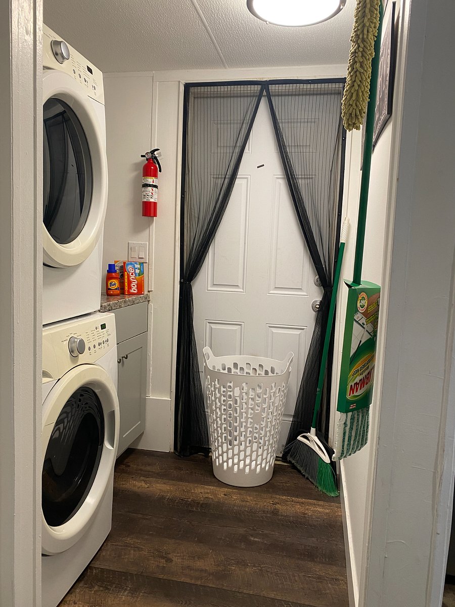 Laundry room. Door leads to back deck and sauna