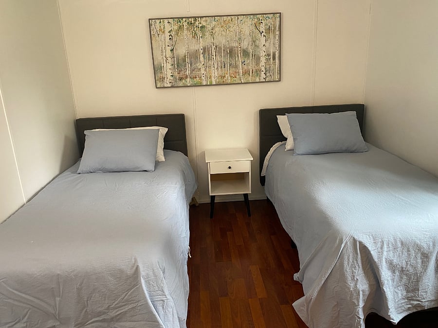 2nd bedroom at opposite end of home from Primary. Twins could be joined to make a king if preferred