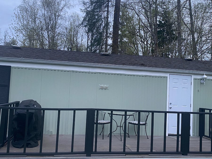 Back deck with bistro set and BBQ. Nice quiet spot with mountain views to enjoy your morning cuppa coffee