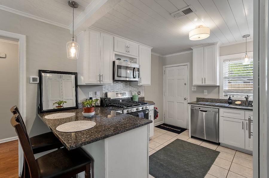 ALL of the appliances in the kitchen are updated and stainless steel.
The kitchen is great and the doors next to the refrigerator conceal the standing laundry unit.