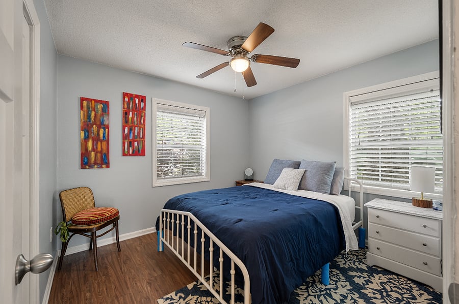 The secondary bedroom is cool and also a great sleep with a lower bedframe than the primary bed. In the closet there are extra pillows, an extra blanket and hangers. This rooms stays much darker in the mornings due to the large oak tree outside!