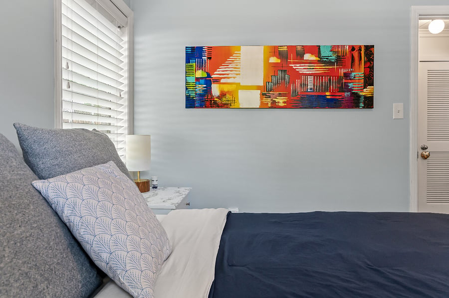 The secondary bedroom has some cool artwork!