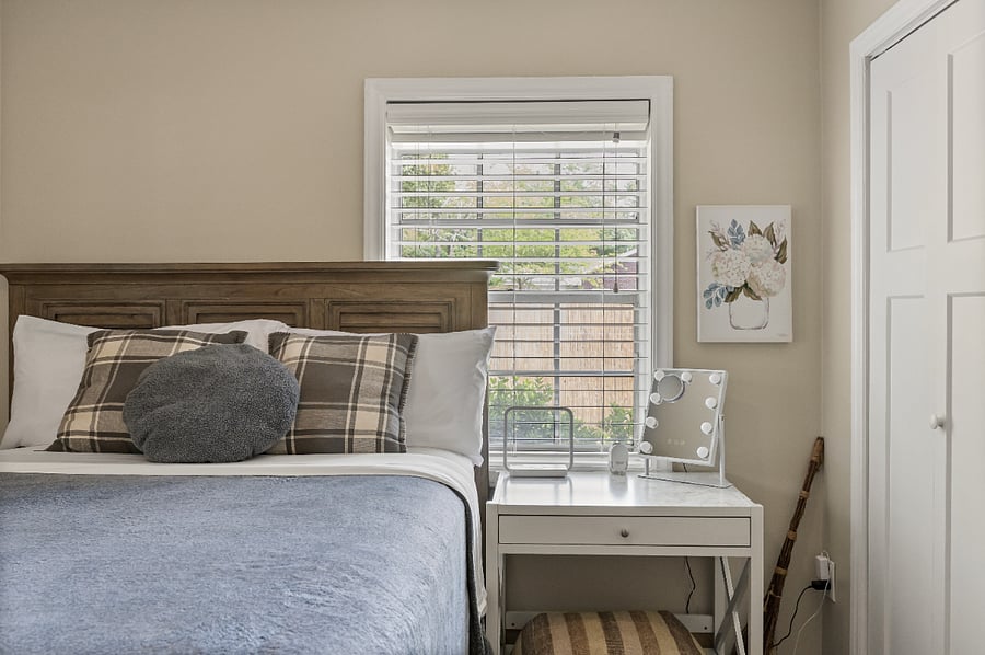 The primary bedroom is soft, inviting and as we hear often, is a great sleep! In the closet there are extra pillows, an extra blanket and hangers for your nicer clothes. Not pictured is the dresser that has 3 large drawers and a big lamp on top.