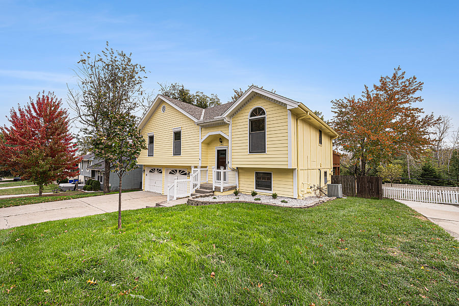 A lush, open front yard greets you with vibrant greenery, creating a warm and inviting first impression that instantly makes you feel at home.