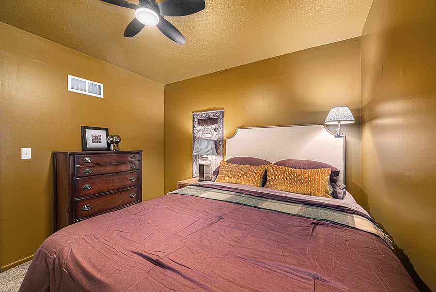 A thoughtfully designed bedroom with a distinctive style, offering a cozy and welcoming atmosphere with plenty of personality.