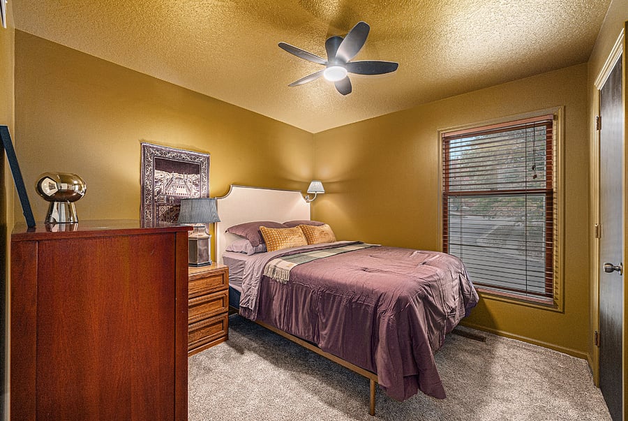 Unwind in a comfortable bedroom designed for two, complete with essential furnishings that create a practical and relaxing everyday space.