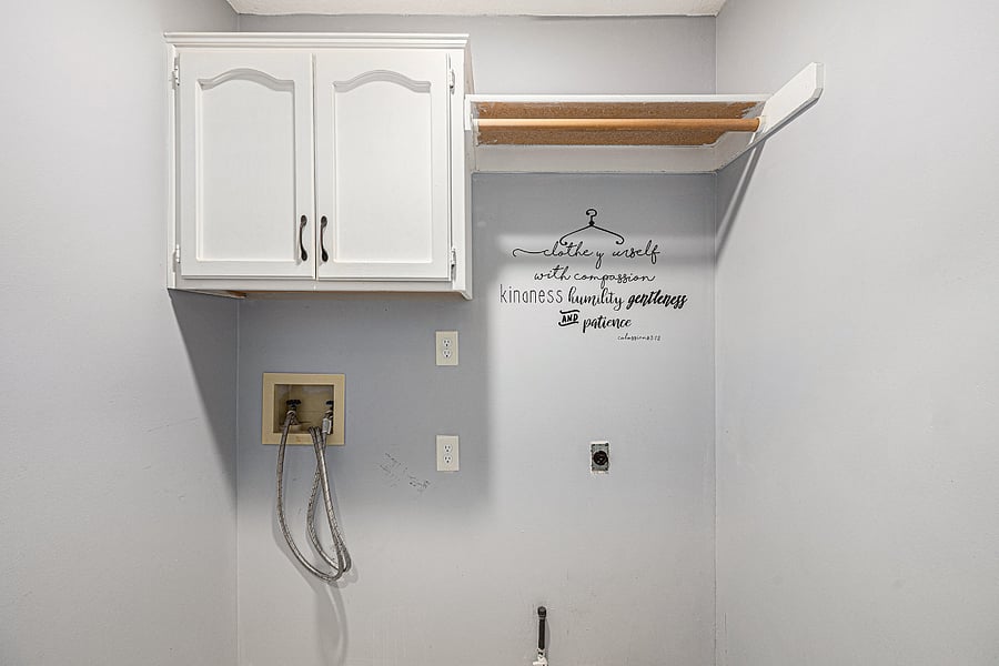 Functional and well-equipped, the laundry area features wet and dry machines, providing a convenient and practical space for household tasks.