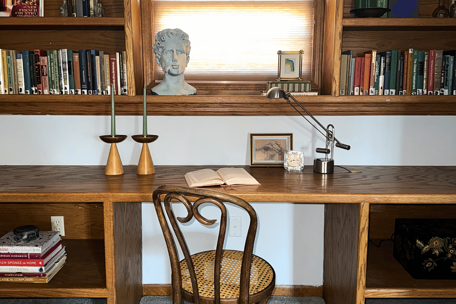 A serene study nook designed for concentration, featuring a spacious desk, cozy seating, and natural light to fuel your creativity.