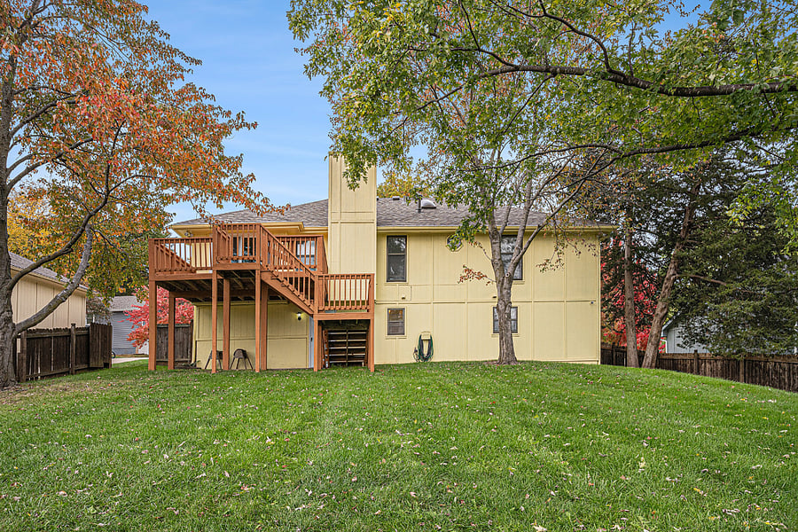 A generous backyard with well-kept grass offers room to unwind, entertain, or enjoy fresh air in a serene, open outdoor space.