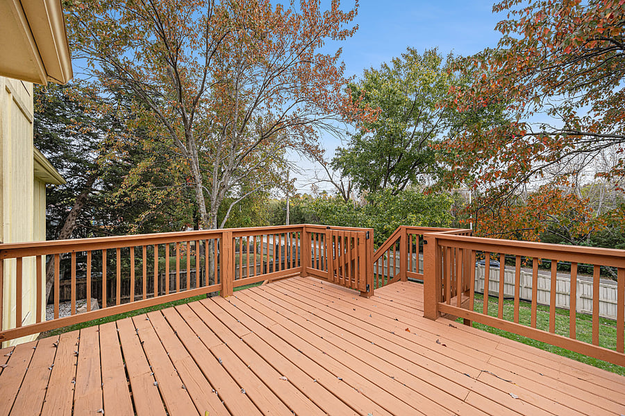 A large deck offers an inviting outdoor space to unwind, host guests, or savor breakfast, combining comfort and fresh-air living in one spot.