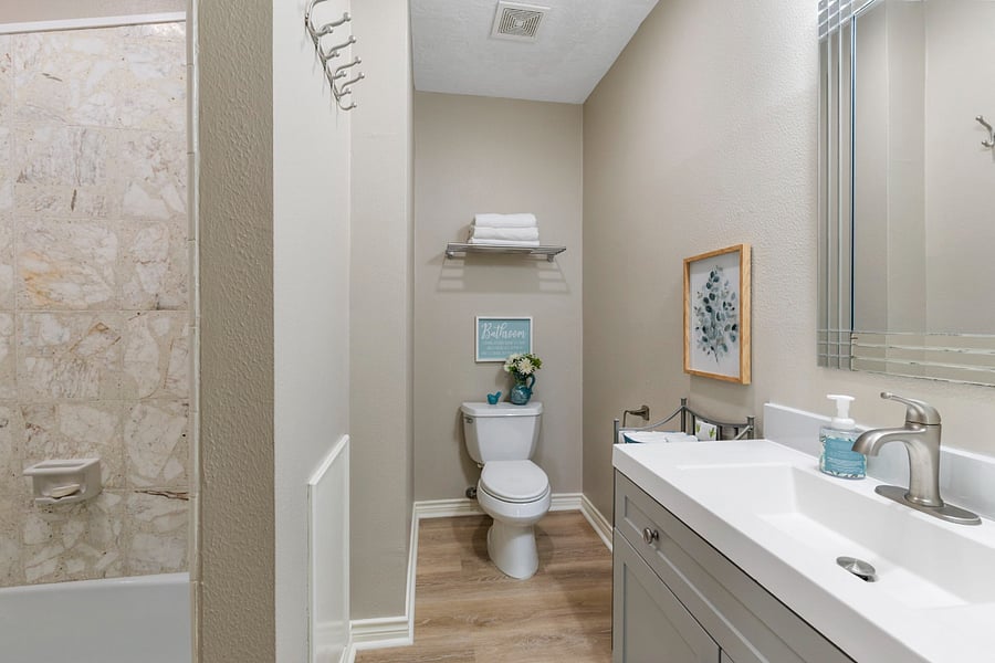 The bathroom has a shower/tub.