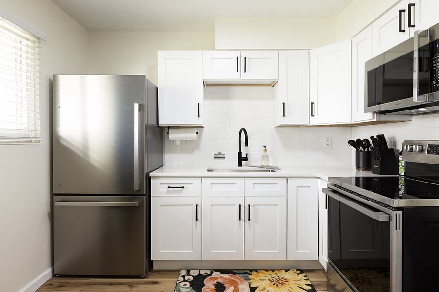 Kitchen with full-size refrigerator and stove