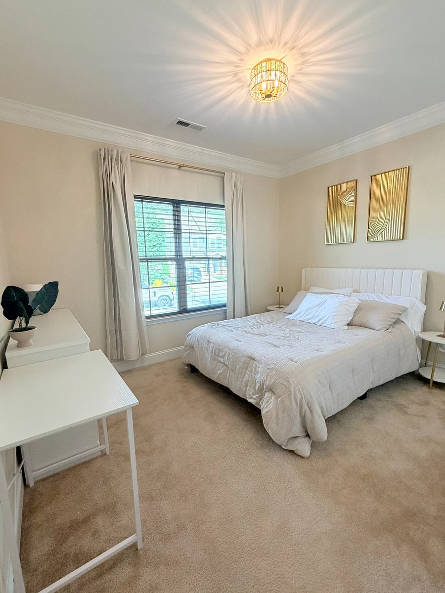 Bedroom #3 w/ queen bed, desk, dresser & TV.Comfy queen bed w/ night stand. Equipped w/ power strip that has outlets, USB and USB-C ports. 