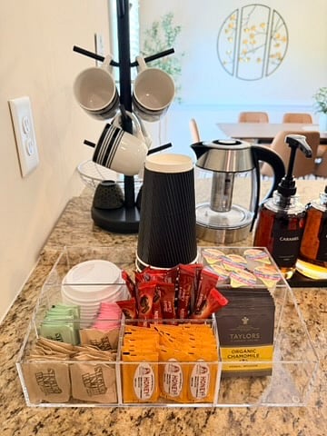 Premium Coffee & tea bar w/ electric water kettle.
Be your own barista! Customize your Coffee and/or tea w/ our selection of sugar, cream, honey, sweeteners & 1883 flavored syrups in caramel, hazelnut & vanilla. Enjoy in a mug or a disposable cup!