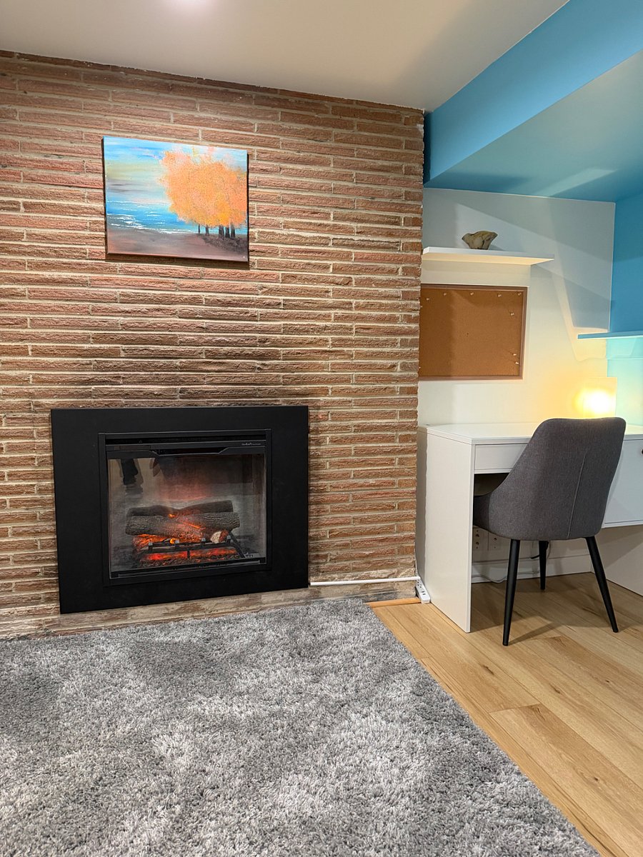 Electric fireplace in sleeping area.