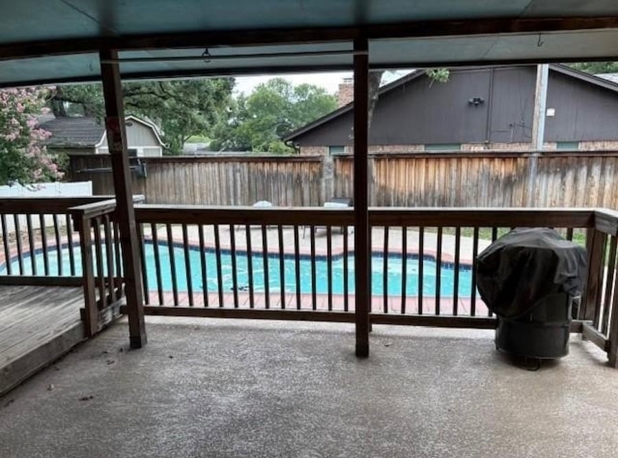 Back patio with smoker and dining area