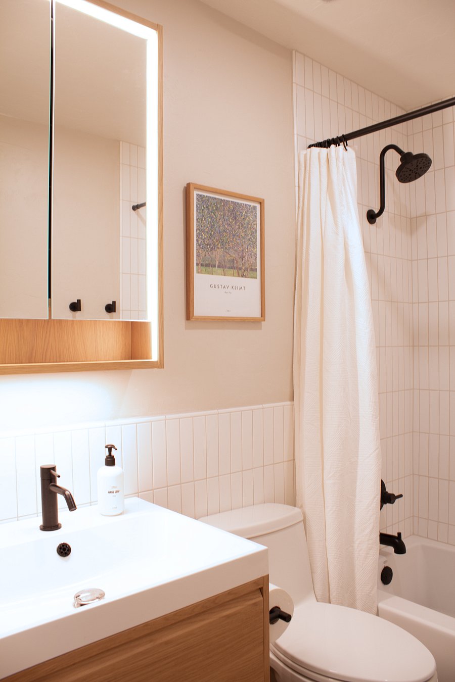 Additional bathroom with modern vanity and everyday essentials.