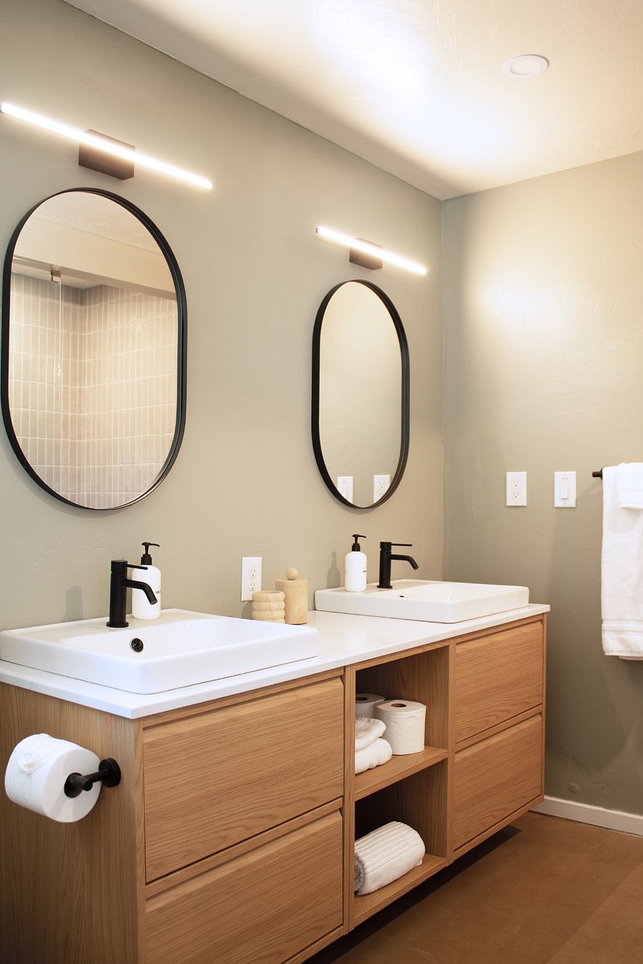 Modern ensuite bathroom with double vanity and walk-in shower.