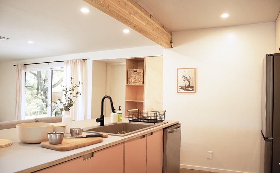 Expansive views from the kitchen island. Modern kitchen with stainless appliances and thoughtful finishes throughout.