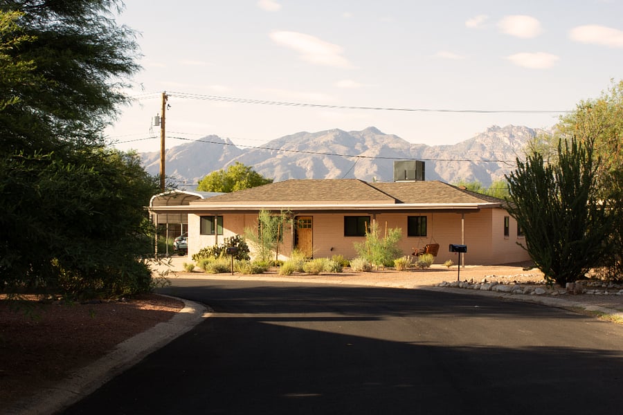 Desert ranch-style home with beautiful mountain backdrop in a quiet residential setting.