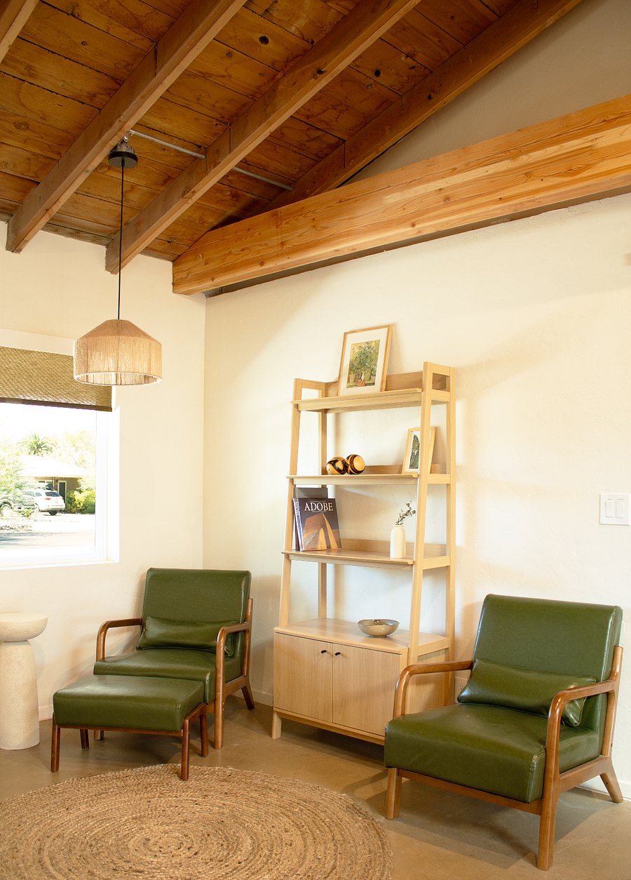 Cozy seating nook with vaulted ceiling and exposed beams.