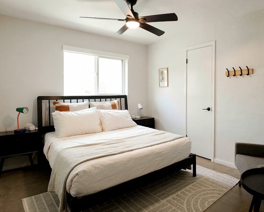 Comfortable bedroom with queen bed and clean, modern finishes.