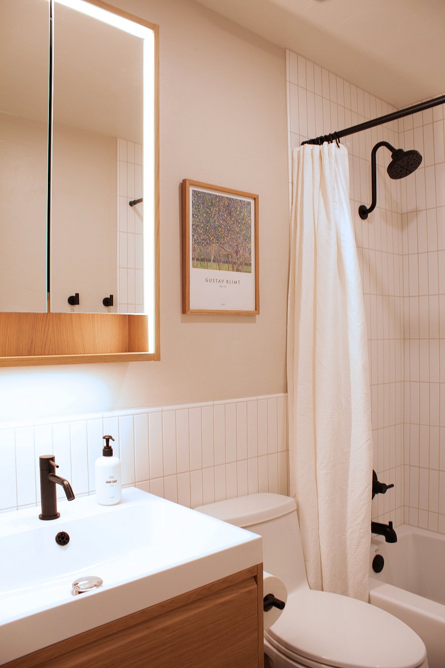 Additional bathroom with modern vanity and everyday essentials.