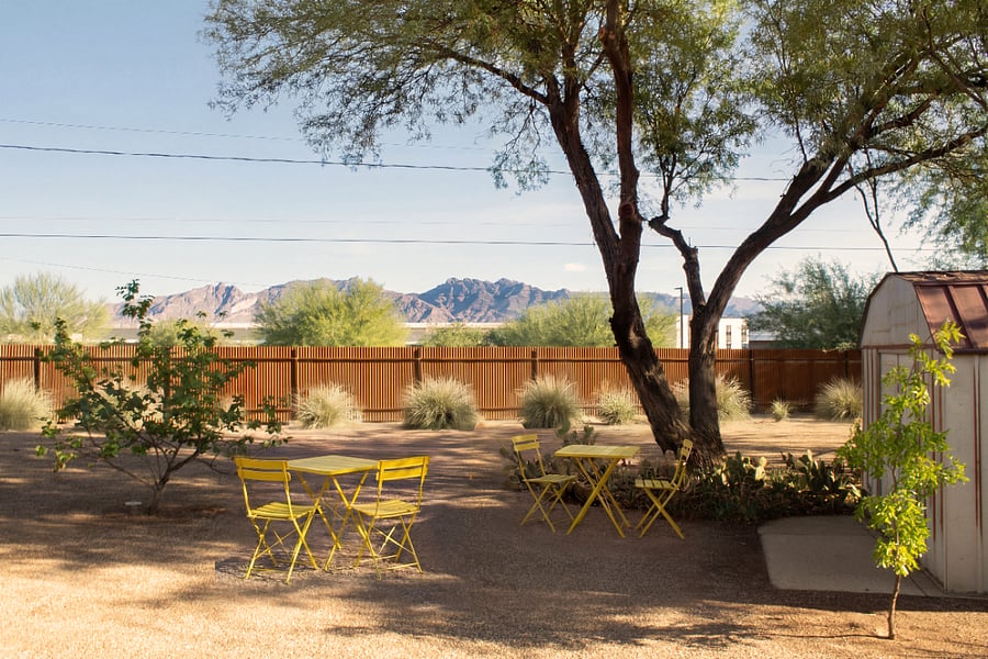 Catalina Mountain views from the yard's shady corner  bistro seating tucked under the mature mesquite tree.