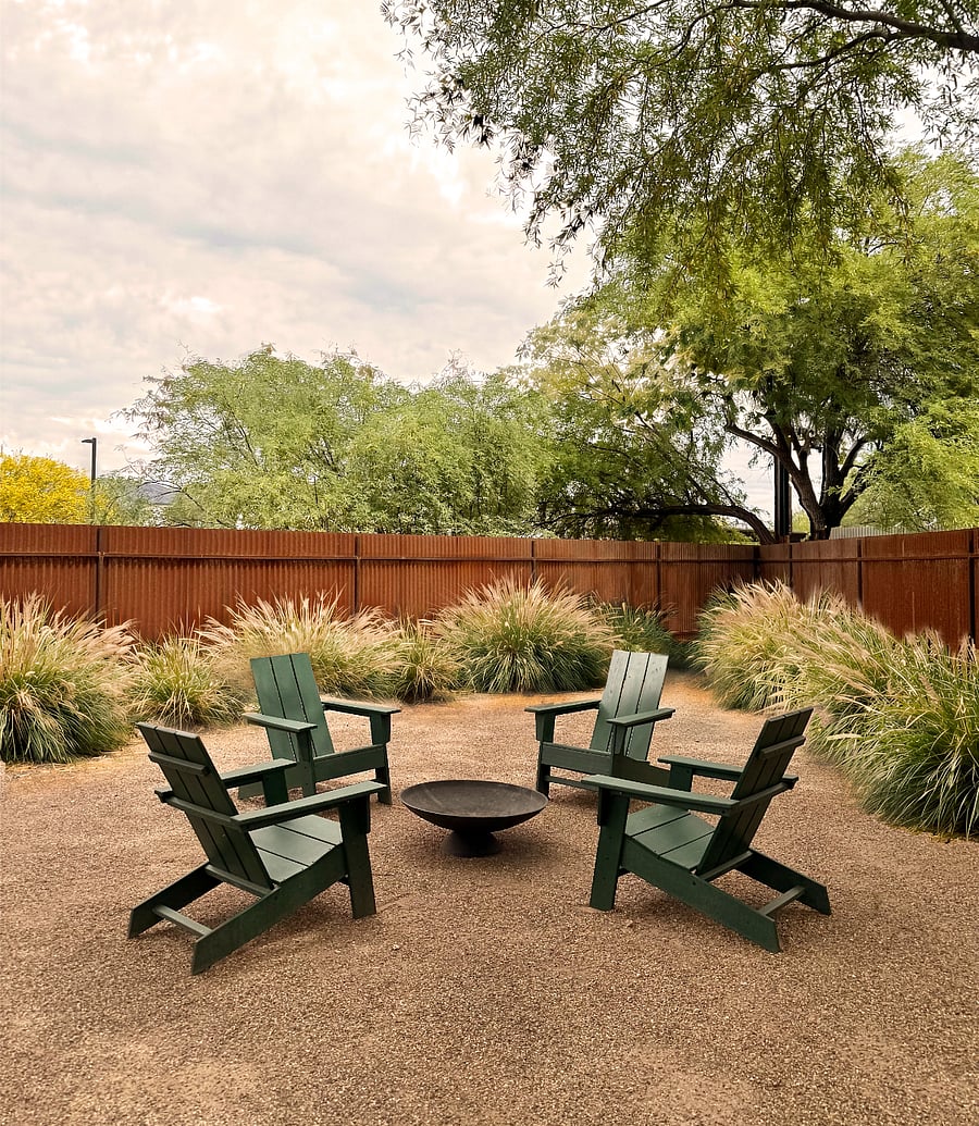 Fenced backyard fire pit lounge - a quiet, private space to unwind after a long day.
