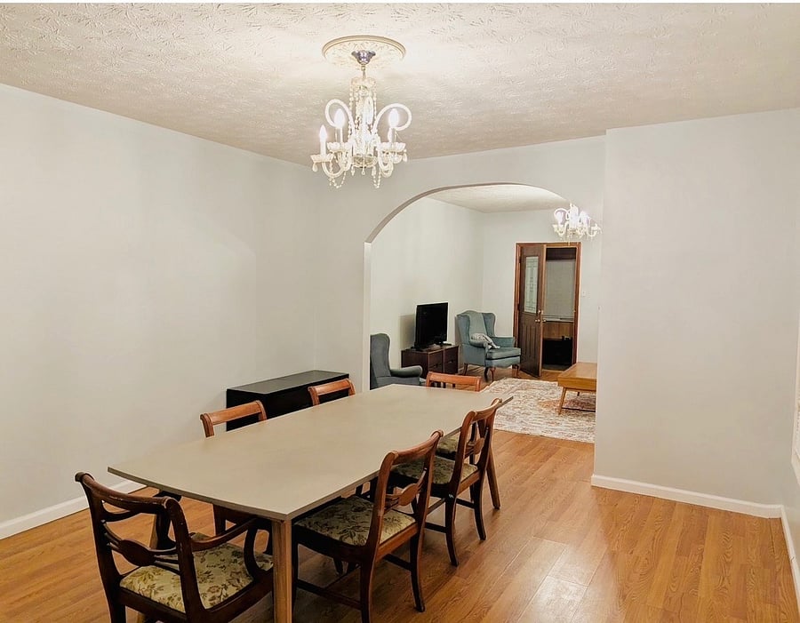 Dining room featuring a large beautiful dining room table that seats up to 8.