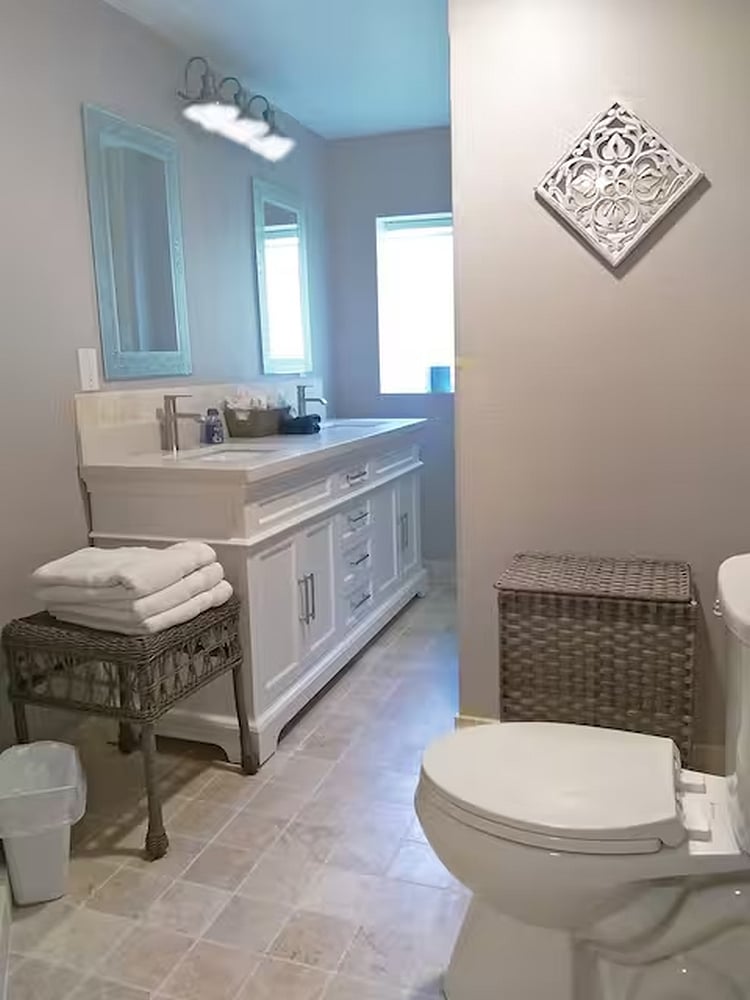 Tub / shower. Two sinks, and toilet.