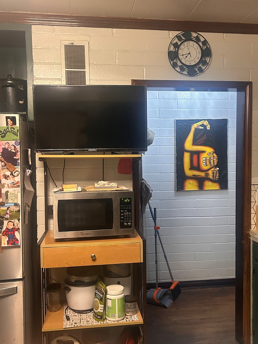 Microwave and TV in kitchen