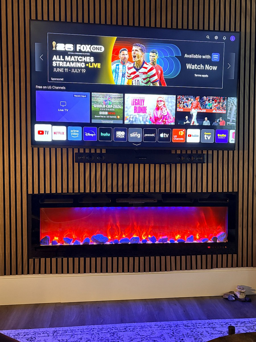 Electric fireplace and 65" smart TV. Google Fiber internet included; apps are available for you to use your own login