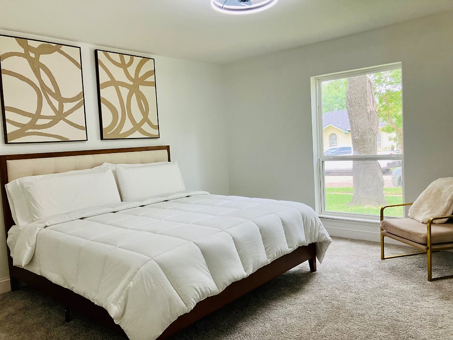 Thoughtfully designed primary bedroom featuring a king bed, offering comfort and a restful atmosphere.