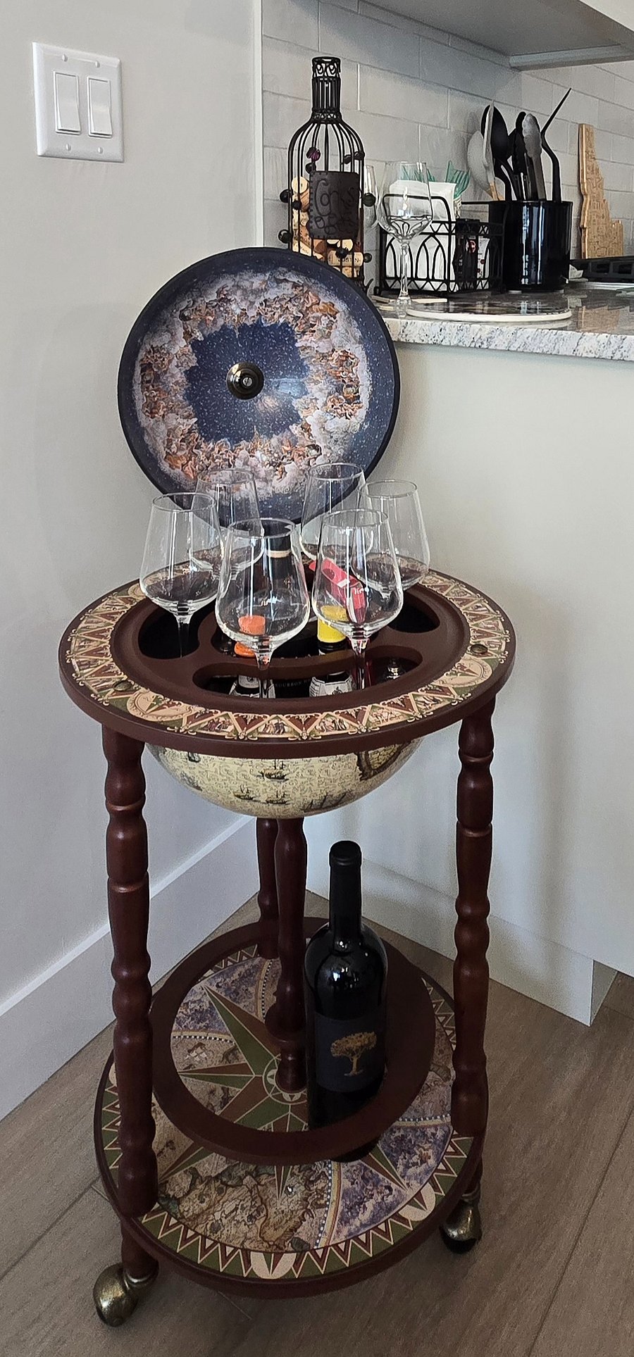 For a touch of fun and elegance, we have a globe wine and liquor caddy, perfect for sharing spirits and creating memorable moments with friends.
