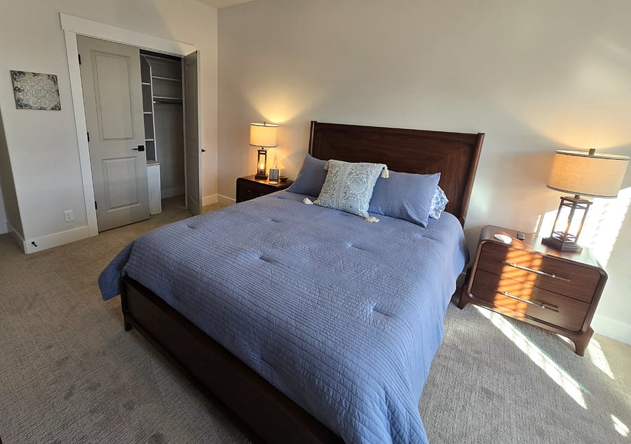 The closet in Bedroom 2 features built-in organizers, providing ample space to neatly store your clothes and belongings for a tidy and convenient stay.