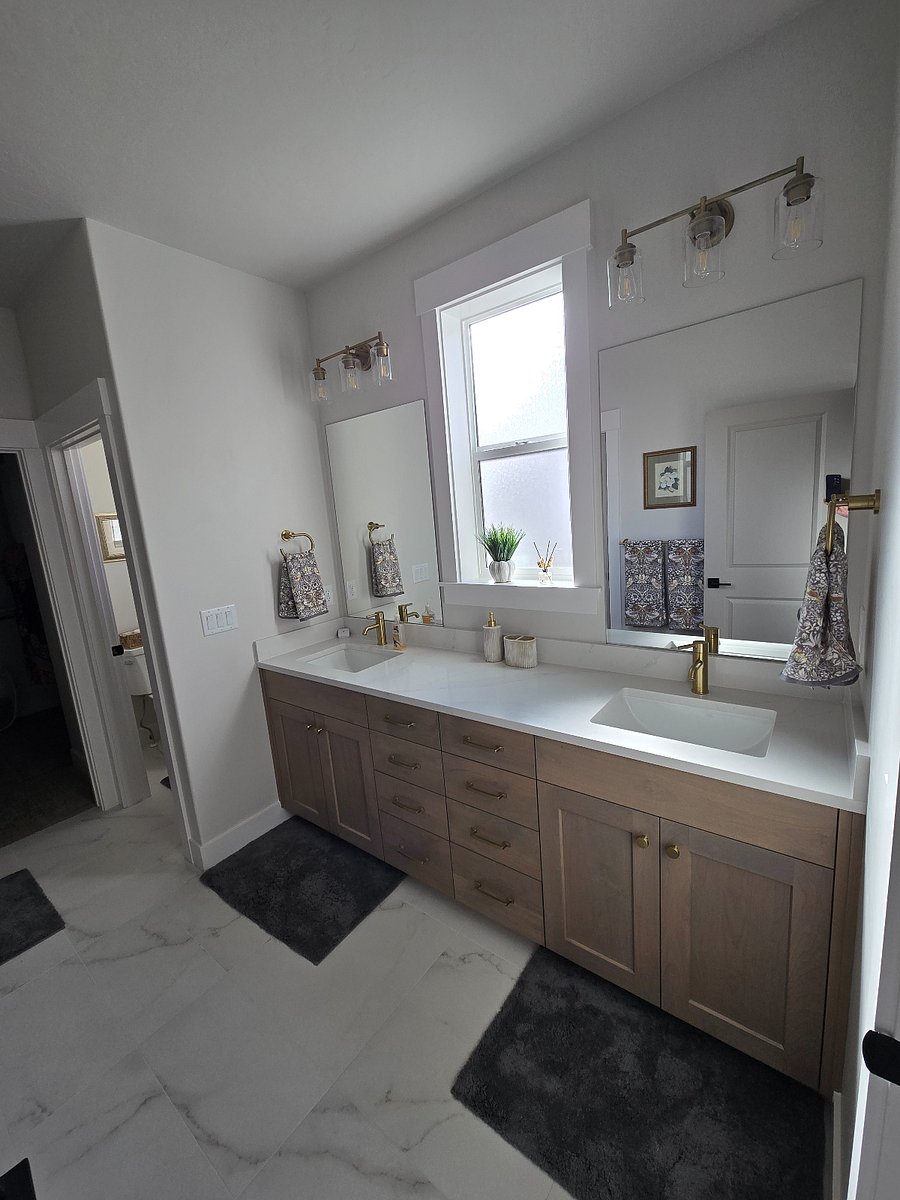 The master ensuite features a double sink vanity with ample drawers and storage space, providing plenty of room to meet all your personal needs comfortably and conveniently.